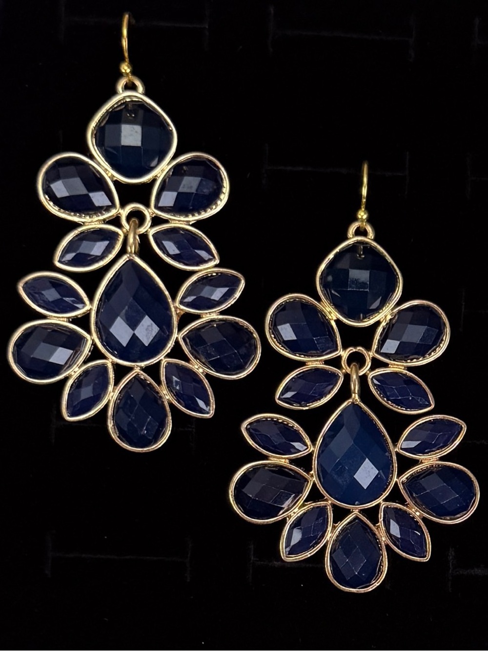 Goldtone, navy blue weighted, hinged statement, pierced earrings